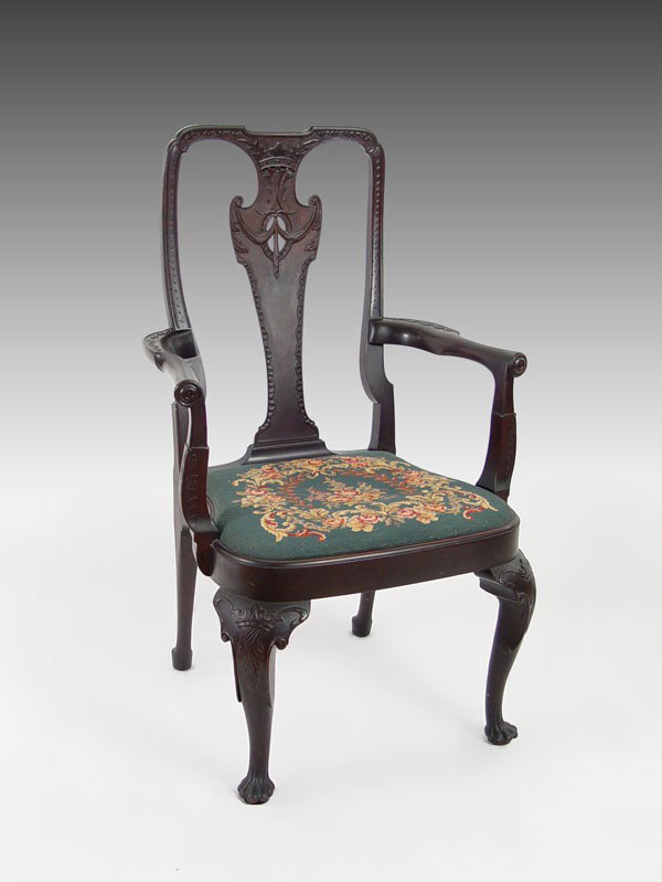 TIFFANY STUDIOS CARVED MAHOGANY ARM CHAIR: SIGNED ''TIFFANY STUDIOS'' MAHOGANY CHIPPENDALE STYLE ARM CHAIR: Reproduction fine quality carved arm chair with carved crown at crest and legs, floral wreath needle point seat on cabriole lets and ri