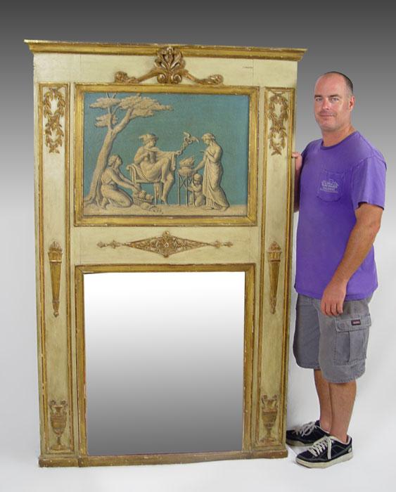 DIRECTOIRE PERIOD TRUMEAU MIRROR: DIRECTOIRE PERIOD TRUMEAU MIRROR: Inserted oil painting on canvas depicts a scene with gods, Mercury. Mirror frame has worn painted finish, indicative of it's age, 71'' X 42''. From the collection of 