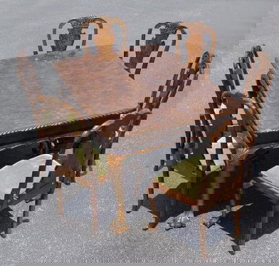 BURL WALNUT DINING TABLE 6 CHAIRS: RICHLY GRAINED BURLED WALNUT DINING TABLE AND CHAIRS: Draw leaf TABLE with gadroon edging, acanthus leaf carvings on the cabriole legs, and carved paw feet, 59''l x 39''h, with leaves extend to 105'',