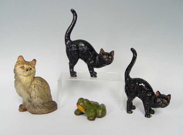 4 CAST IRON DOORSTOPS- 3 CATS AND A FROG: 4 CAST IRON DOORSTOPS- 3 CATS AND A FROG: Black cats are modern production. White cat measures 8 3/4" h. x 6" x 4".
