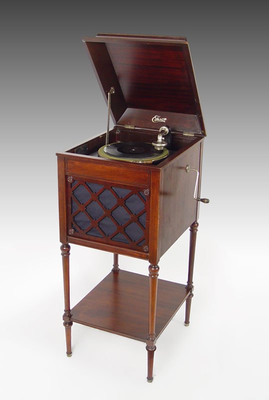 EDISON MAHOGANY CASE UPRIGHT PHONOGRAPH: EDISON MAHOGANY CASE UPRIGHT PHONOGRAPH: Model A100, serial number SM 27899. 41 3/4" h. x 18" x 21".