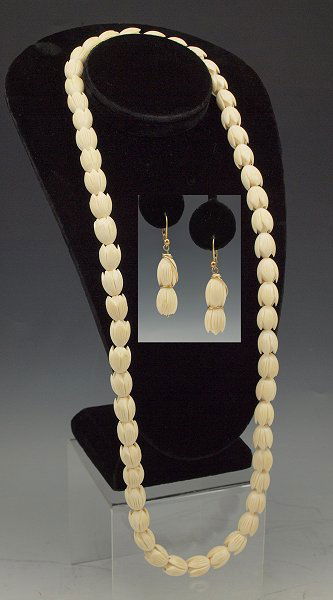 CARVED IVORY BEAD NECKLACE AND EARRINGS: CARVED IVORY BEAD NECKLACE AND EARRINGS: Blossom motif beads one being the screw clasp, 32"l., matching dangle earrings on gold filled lever back hoop findings, 1 3/4"l.