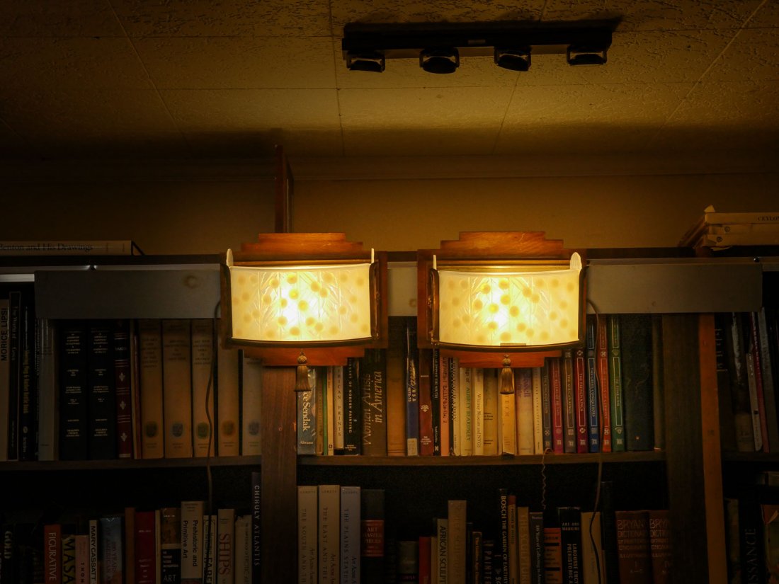 PAIR OF PERIOD ART DECO OPALESCENT GLASS SCONCES: PAIR OF PERIOD ART DECO OPALESCENT GLASS SCONCES: Sabino?, Lalique?, Two sconces, each with 4 opalescent glass panels with a cherry & foliate motif. All housed in a metal frame mounted on a wood wall 