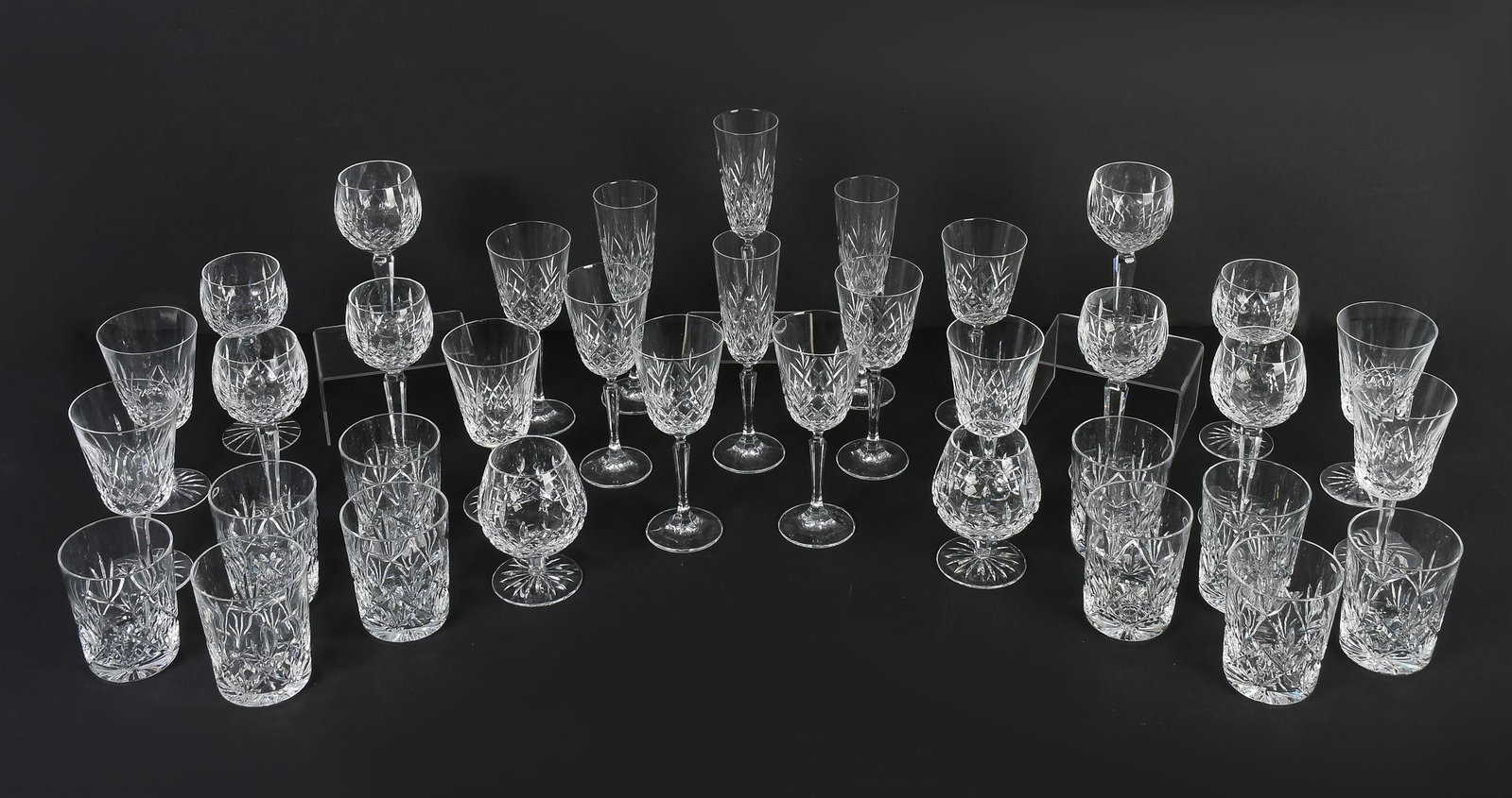 36 PC. WATERFORD CRYSTAL ''LISMORE'' COLLECTION: 36 PC. WATERFORD CRYSTAL "LISMORE" COLLECTION: Comprising; 6- Parfait glasses, 2- Cognac snifters, 10- Double old-fashioned glasses, 4- Flutes, 6- Tall wine glasses, & 8- White wine glasses. Tallest. 