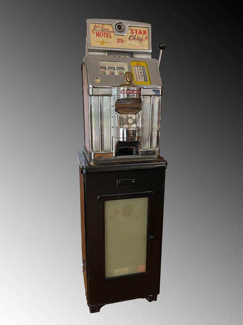 ART DECO JENNINGS STAR CHIEF 25 CENT SLOT MACHINE: ART DECO JENNINGS STAR CHIEF 25 CENT SLOT MACHINE: 25 Cent Jennings & Co., Star Chief "Chase Hotel" Slot Machine, Restored. Resting on a black painted metal dentistry cabinet. Slot machine Approx. 27.