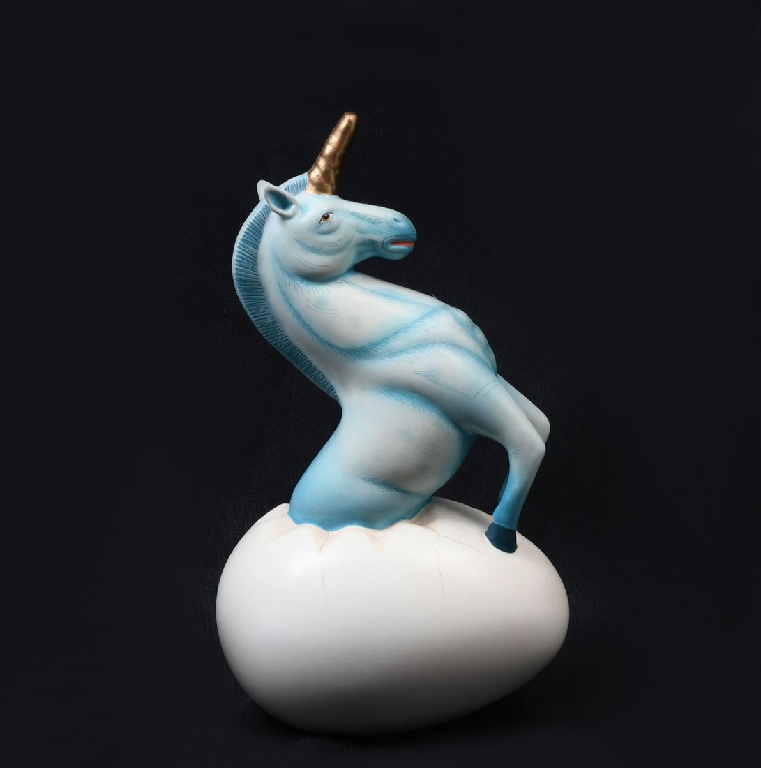 SERGIO BUSTAMANTE UNICORN EGG: BUSTAMANTE, Sergio, (American, b. 1949): Unicorn Breaking Out of an Egg, approximately 9" in height, signed.