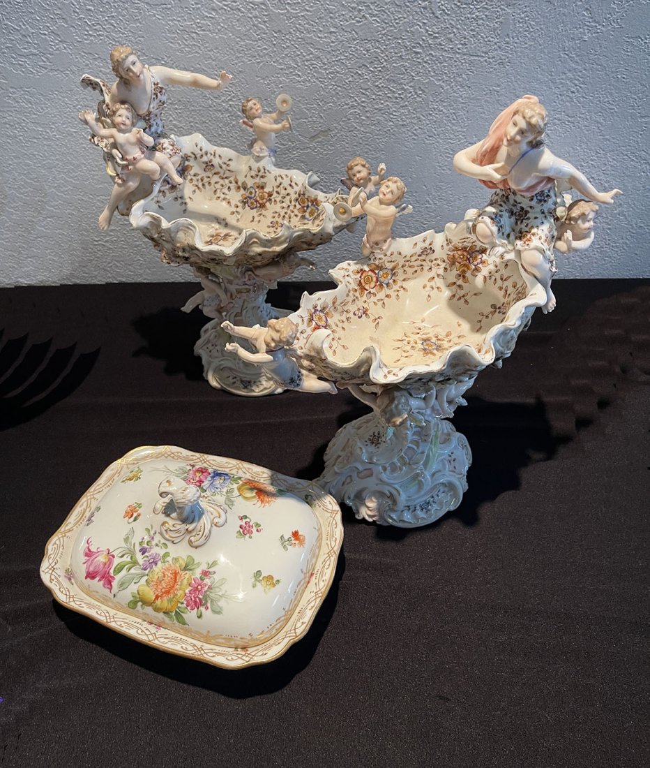 3 PC. GERMAN PORCELAIN COMPOTES & COVERED DISH: 3 PC. GERMAN PORCELAIN COMPOTES & COVERED DISH: Comprising; 1- Meissen covered dish, & 2- German porcelain compotes, having cherubs and a bare breasted female. Largest Approx. 12" h x 10" l x 5.75" w.
