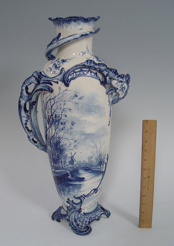 22 inch ROYAL BONN BLUE DECORATED VASE: OVERSIZED ROYAL BONN BLUE DECORATED VASE: Decorated in a blue Delft scenic landscape. 22" tall, 11" wide overall. Well marked. Please note two small losses as seen in the photo.