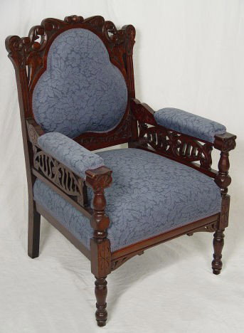 AESTHETIC MOVEMENT ARMCHAIR, CA 1880: AESTHETIC MOVEMENT ARMCHAIR, CA 1880: Carved wood arm chair, blue damask upholstery. 37 1/2''h., 24''w.