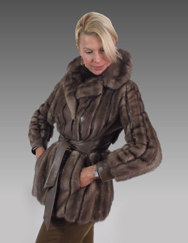 SIZE 6 MINK JACKET: SIZE 6 MINK JACKET: Cappuccino color mink and leather jacket with attached belt and leather cuffs, Slight wear to cuffs.