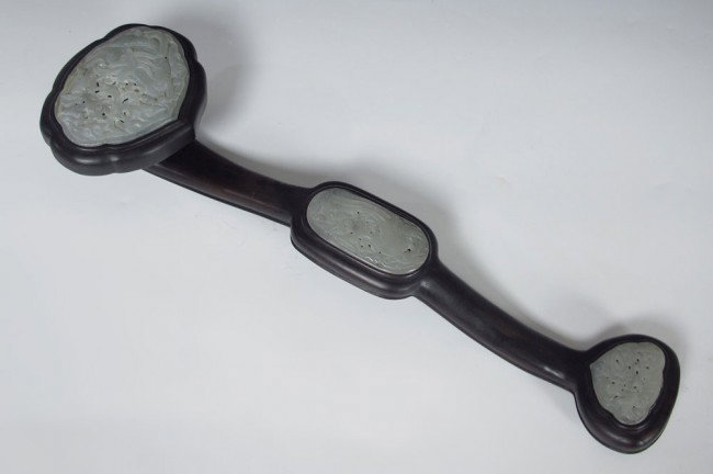 NEPHRITE AND WOOD RUYI SCEPTER : ORNAMENTAL RUYI SCEPTER: Carved hard stone nephrite and wood, 20 1/2"l.