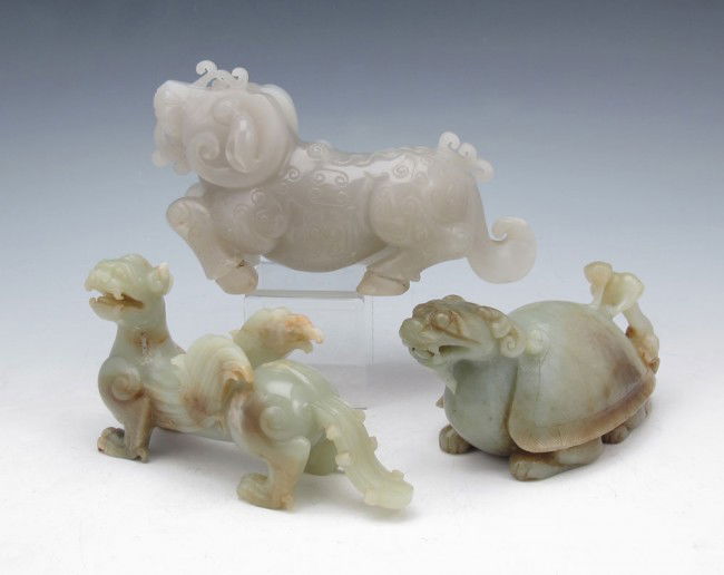 3 CHINESE HARD STONE FIGURAL CARVINGS: 3 CHINESE HARD STONE FIGURAL CARVINGS: Nephrite dragon and mythical beasts. Approx. 5 1/2"l. x 3 1/2" tall.