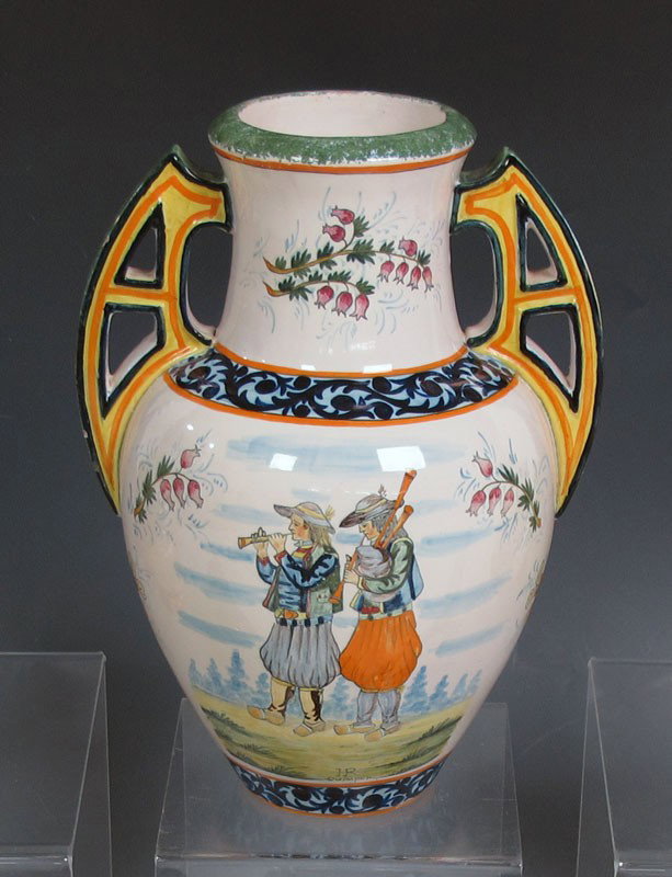 QUIMPER FRENCH FAIENCE DOUBLE HANDLE VASE: QUIMPER FRENCH FAIENCE DOUBLE HANDLE VASE: Hand painted musician motif with pink heather, heraldic crest verso. 11 1/2" tall. Signed HR Quimper 1 France.