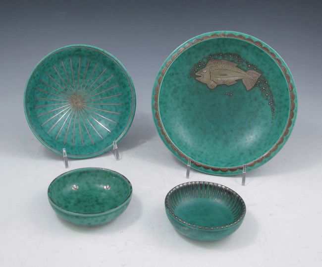GUSTAVSBERG ARGENTA SILVER INLAID POTTERY: 4 PIECE SILVER INLAID GUSTAVSBERG ARGENTA POTTERY BOWLS: Largest to smallest. 1) Fish design, 7" dia. 2) Starburst design, 5 3/4" dia. 3) Three petal flower design, 3 1/2" dia. 4) Ribbed edge, 3".