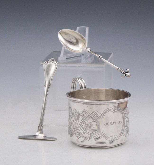 3 PIECE CHILDS STERLING CUP, PUSHER, AND SPOON: 3 PIECE CHILDS STERLING CUP, PUSHER, AND SPOON: To include 1) International Sterling childs mug engraved with ABC blocks and monogrammed Jonathan. 2 1/2'' h. x 3 7/8''. 2) Gorham food pusher, 4''. 3) 