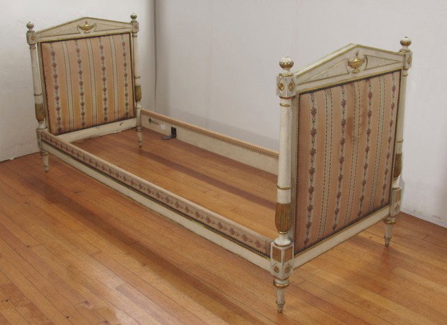 JANSEN FRENCH EMPIRE STYLE DAYBED:: JANSEN FRENCH EMPIRE STYLE DAYBED: Painted and gilt wood with neo-classical urn and pediment design. Upholstered boards and rails. Approx. 36" tall x 67" x 29 1/2".