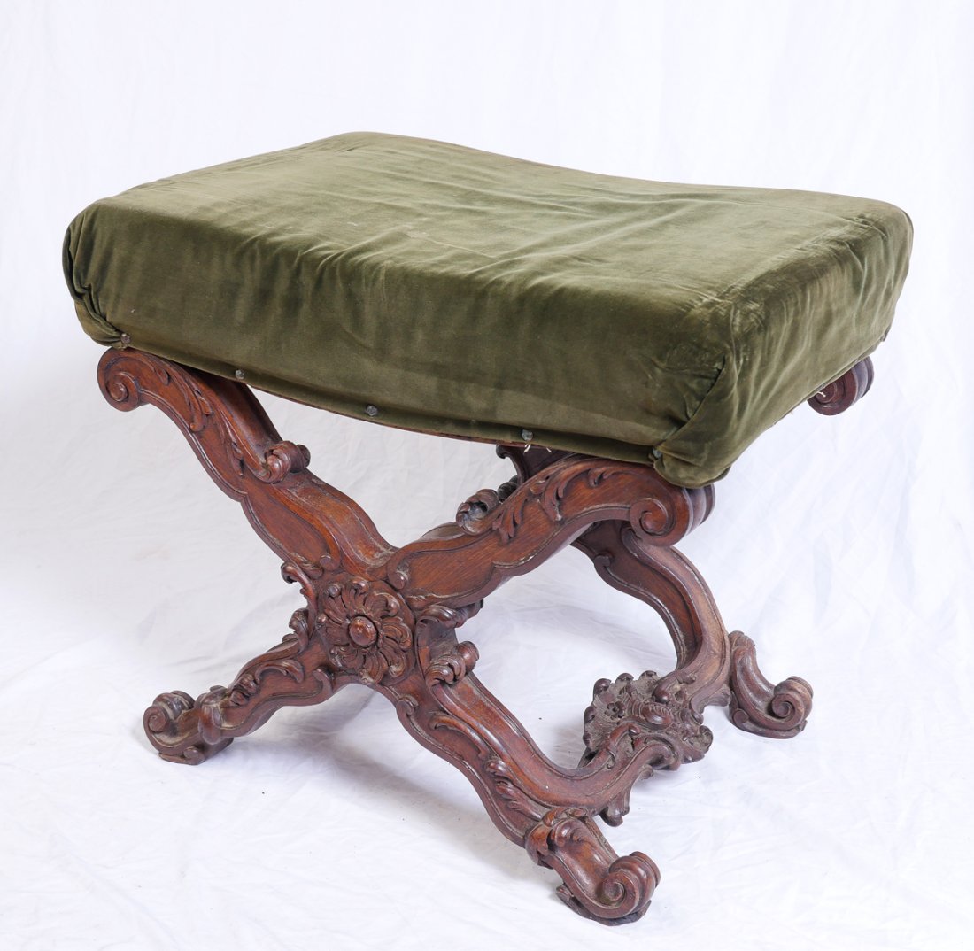 EARLY CARVED & SIGNED WINDOW SEAT: EARLY CARVED & SIGNED WINDOW SEAT: Possibly Portuguese, having a heavily carved "X"-form frame. Scrolling Acanthus & floral medallion motif. Raised on scrolling feet. Signed Junnii? at the underside r