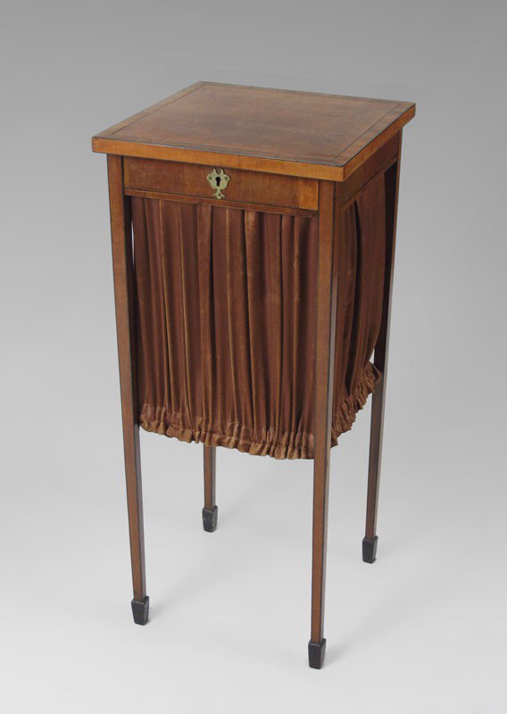 REGENCY INLAY SATIN WOOD WORK STAND: REGENCY INLAY SATIN WOOD SEWING STAND: Ca. 1800. Lift top to access the fabric walled interior. Long tapered legs ending in spade feet. Sold with the 1964 purchase and shipping order from an antiques 