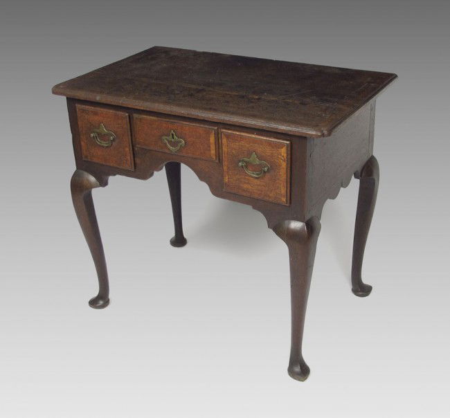 PERIOD ENGLISH QUEEN ANNE LOWBOY: PERIOD ENGLISH QUEEN ANNE LOWBOY: Three drawer front with original brasses. Whale tail cut apron, cabriolet legs and snake foot. 28" h. x 32" x 20".