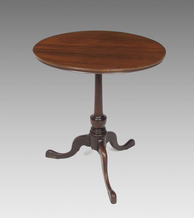 LATE 18TH CENTURY CHERRY SNAKE FOOT CANDLE STAND: LATE 18TH CENTURY CHERRY SNAKE FOOT CANDLE STAND: One board top on fine turned pedestal with shield design on 3 shaped legs and snake foot. 23" h. x 20 1/2" round.