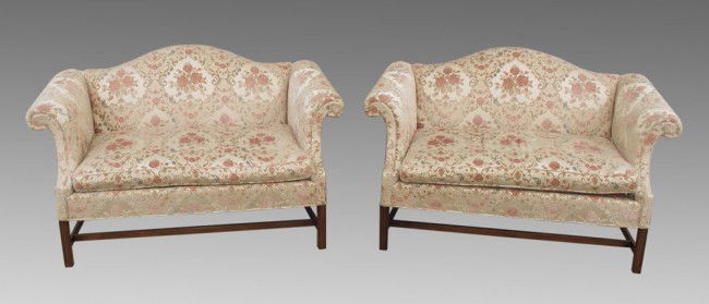 PAIR HICKORY CHAIR CO. CAMELBACK SETTEES: PAIR HICKORY CHAIR CO. CAMELBACK SETTEES: Floral upholstery. Approx. 37" h. x 57" x 28 1/2".