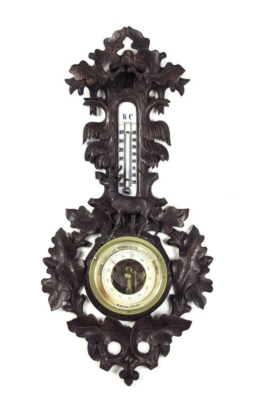 BLACK FOREST GAME ENHANCED BAROMETER: BLACK FOREST GAME ENHANCED BAROMETER: Late 19th to early 20th century, nicely carved with stag and oak leaves. Aneroid barometer, porcelain thermometer plaque reading Celsius & Rankine. Barometer sign