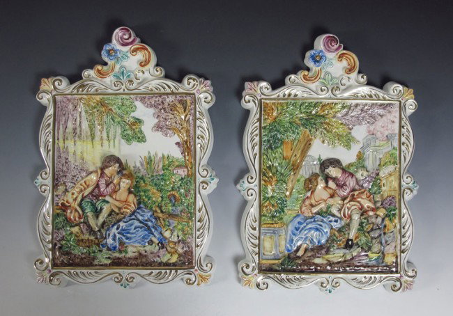 PAIR CAPO DI MONTE PLAQUES: PAIR CAPO DI MONTE PLAQUES: Featuring relief scenes of lovers in park and city. Handpainted with gold decoration. R. Capodimonte marke 1535/394B Italy. 20" h. x 13 1/2" x 1 1/4".