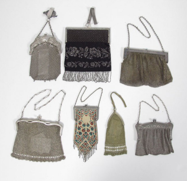 7 PC. VINTAGE PURSES GERMAN & 800 SILVER : 7 PC. VINTAGE MESH AND BEADED PURSES: To include 2 German silver bags, one with chatelaine hook, unmarked colored enamel mesh, two 800 silver purses, and a silver on black beaded bag, the largest at 7