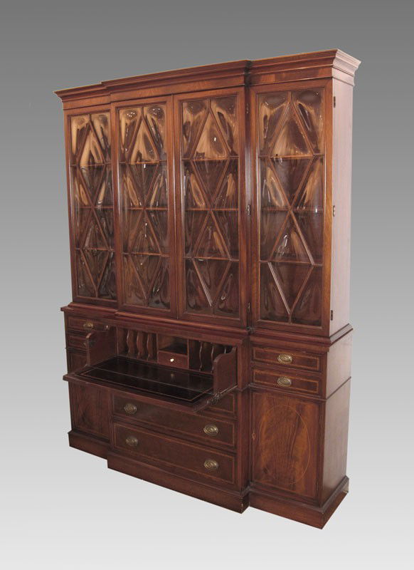 MAHOGANY BREAKFRONT CHINA CABINET BOOKCASE: JOHN STUART MAHOGANY BREAKFRONT CHINA CABINET BOOKCASE: 4 bubble glass door top over 7 drawer 2 door base with slide out desk. String inlay on base. Original John Stuart tag. 85 1/2" h. x 65 1/4" x 18