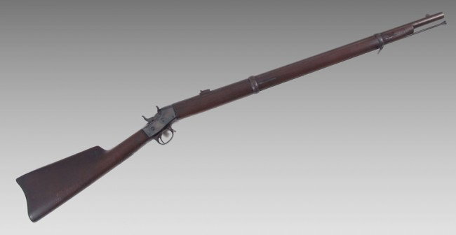 19TH CENTURY REMINGTON ROLLING BLOCK RIFLE: 19TH CENTURY REMINGTON ROLLING BLOCK RIFLE: 27 3/4'' 2 band barrel. Typical Remington marking on frame with P over FCW inspector marks. Frame retains some blue finish. 42 1/2'' overall.