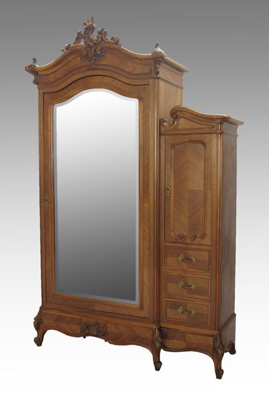 FRENCH WALNUT ARMOIRE: FRENCH WALNUT ARMOIRE: Carved crest over door with full length beveled mirror, 4 adjustable interior shelves. Right side single door over 3 drawers. 90" h. x 59" x 22"