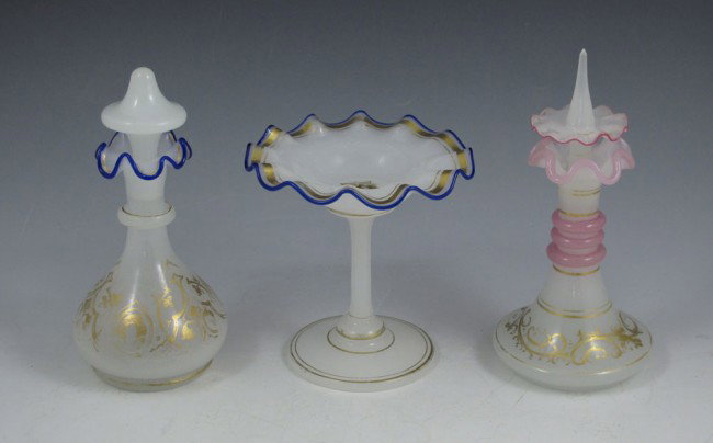 19th C CZECH OPALINE GLASS: 19th C CZECH OPALINE GLASS: 3 piece group to include two perfume bottles. 1) Ring neck stopper, pink edging, 6" tall. 2) Cobalt rim bottle, 5 1/2" tall. 3) Cobalt and gold rim tazza, 3 1/4" tall x 3 1