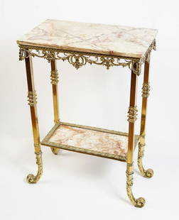 2-TIERED MARBLE AND BRASS STAND: 2-TIERED MARBLE AND BRASS STAND: Brass framed marble top stand, having an overall scrolling foliate motif. Lower shelf stretcher with a marble inset. Raised on scrolling feet. Approx. 31.75" h x 24"