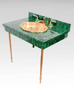 SHERLE & WAGNER MALACHITE SINK & FIXTURES: SHERLE & WAGNER MALACHITE SINK & FIXTURES: Custom made sink with Malachite counter, malachite and gold-plated fixtures, 27" gold-plated tapered reeded legs and a gold-plated bowl. Measures approx.