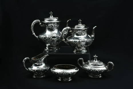 5 PC. GORHAM STERLING SILVER TEA SET: 5 PC. GORHAM STERLING SILVER TEA SET: Approx. 59.34 Troy ounces. Comprising; 1- Coffee pot, 1- Teapot, 1- Covered sugar bowl, 1- Creamer, & 1- Waste bowl. All having a raised floral & scrolling