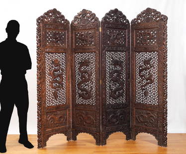 HABIB JOO CARVED DRAGON 4 PANEL FLOOR SCREEN: HABIB JOO CARVED DRAGON 4 PANEL FLOOR SCREEN: Each panel with figural carved dragon crest and trim, pierced openwork panels framed with relief carved dragon motifs. Habib Joo, Kashmir label on side