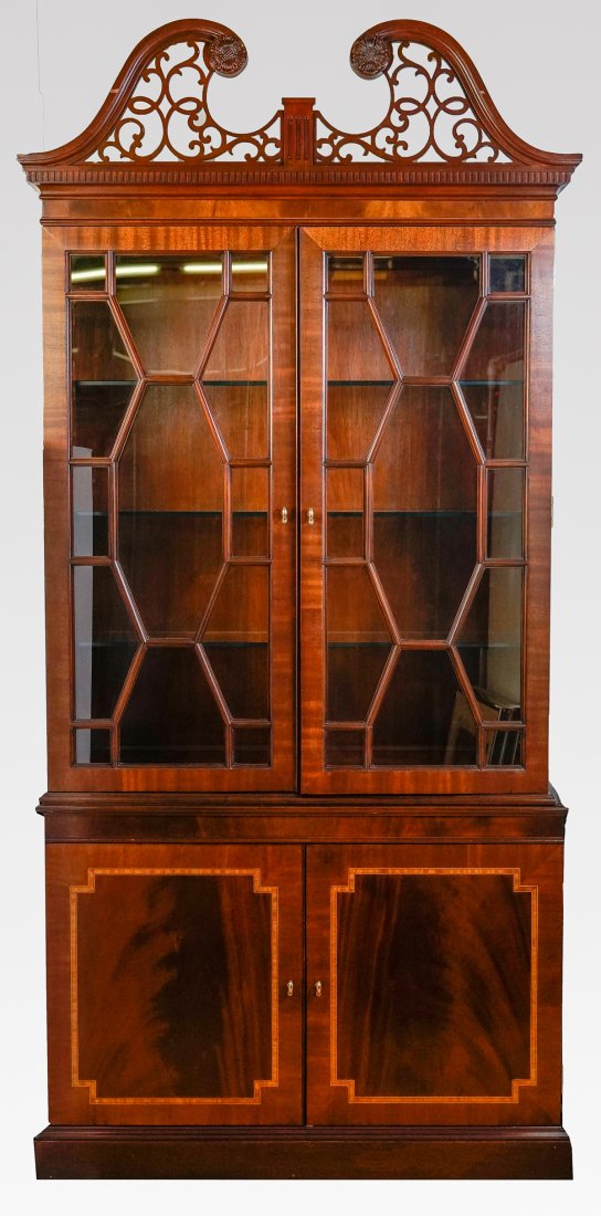 COUNCILL CHIPPENDALE STYLE 4 DOOR CURIO: COUNCILL CHIPPENDALE STYLE 4 DOOR CURIO: "Councill" 2- light curio with three shelves, over two banded doors. Scrolling pediment with scrolling fretwork. Metal Councill tag resides at the reverse. App