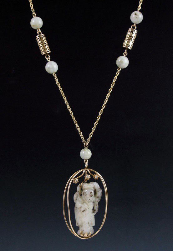 14K GOLD JADE AND DIAMOND NECKLACE 30'': 14K GOLD AND CARVED JADE NECKLACE: 14K yellow gold pendant featuring an antique carved mutton fat jade Quan Yin mounted in two gold oval hoops, and surmounted by three round full cut diamonds, approx.
