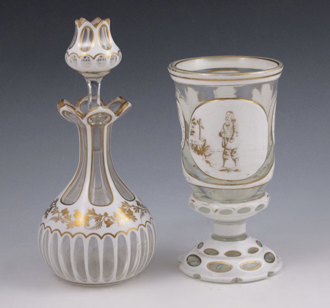2 EARLY BOHEMIAN FLACON AND BEAKER: 2 PIECE EARLY BOHEMIAN WHITE OVERLAY FLACON AND BEAKER: Beaker. 6 1/2''. The perfume bottle measures 7''.
