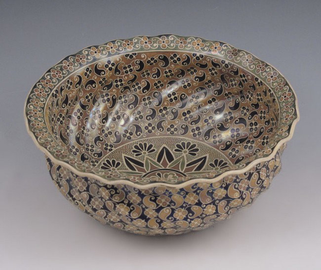 ZSOLNAY PECS IRIDESCENT POTTERY BOWL: ZSOLNAY HUNGARIAN POTTERY BOWL: Pecs, Hungary. All over paisley design with central medallion. Deep violet iridescent ground, marked with the 5 churchs and Pecs in circle. 3 1/2'' tall, 8 1/2'' dia.