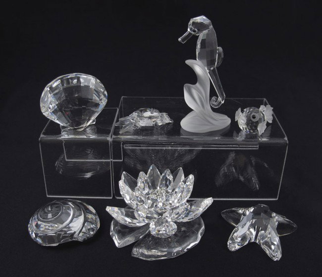 SWAROVSKI CRYSTAL WATERLILY SHELLS BLOWFISH CRAB: SWAROVSKI CRYSTAL FIGURES: 7 pieces to include, LARGE WATERLILY 9100, A. Hirzinger, issued 2005; STARFISH 7624, M. Stamey, issued 1995 retired 2003; Miniature CRAB 7624, M. Stamey, issued 1996 retired