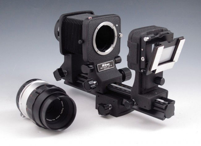 NIKON BELLOWS PB-6 & 55MM LENS: NIKON BELLOWS PB-6 & 55MM LENS: To include 1) Nikon Bellows PB-6 lens from Camera extension. 9 1/8" long. 2) Nikon Slide copying adapter PS-6. 3) Micro Nikkor 55mm lens, note scratches to case.