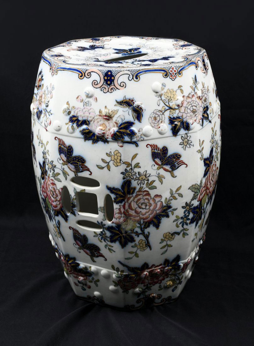 ENGLISH FLO BLUE IMARI STYLE GARDEN SEAT: ENGLISH FLO BLUE CHINOISERIE GARDEN SEAT: Overall floral & foliate motif with Butterflies flying amongst them. 19" h x 13.5" w.