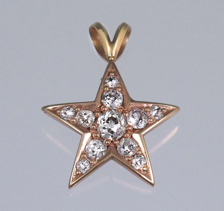 1.25 CTW DIAMOND STAR PENDANT 14K GOLD: MINE CUT DIAMOND STAR PENDANT: 14K yellow gold pendant contains eleven old mine cut diamonds. Weight: 1.25 Ct. Approx. The diamonds average VS in clarity and H-I in color. The diamonds are bead set. W