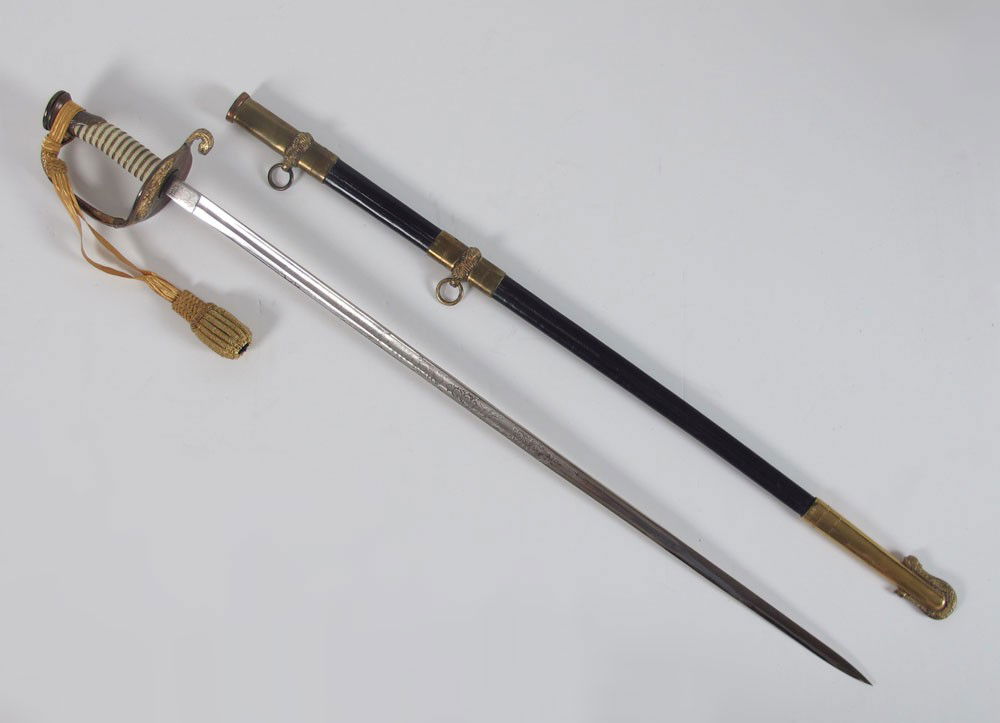 WWII MODEL 1852 NAVAL OFFICERS SWORD: WWII MODEL 1852 NAVAL OFFICERS SWORD: World War II era model 1852 Naval officers sword, scabbard, knot and leather carrying case. 29 1/2'' minty blade with typical Naval motifs, original white shagree