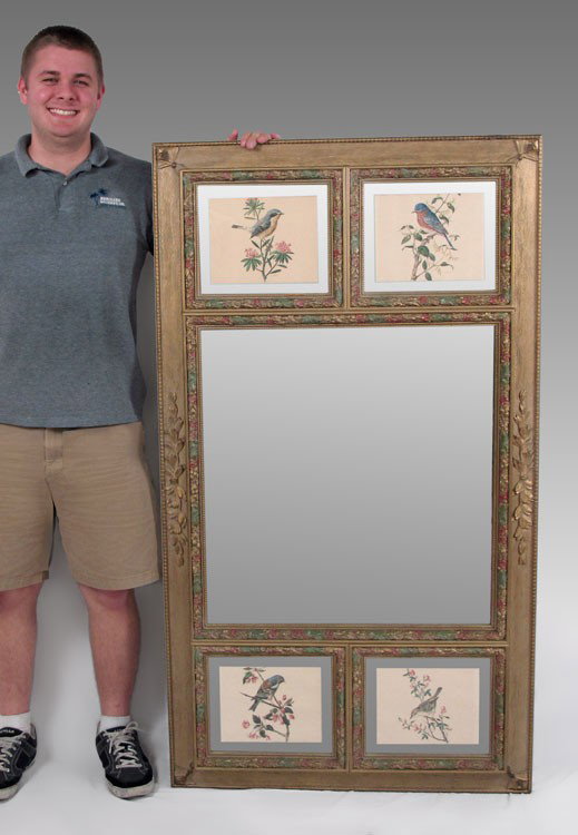 LATE VICTORIAN DECORATIVE PANELED MIRROR: LATE VICTORIAN DECORATIVE PANELED MIRROR: Carved outer frame with wood grain design. Large central mirror edged in hand colored carved molding. 2 panels at top and bottom featuring colored prints of b