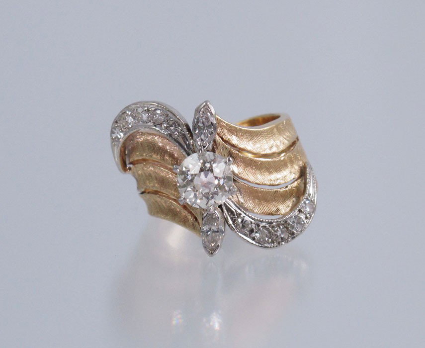 ART DECO 14k GOLD RING 1.47 CT OLD EURO PLUS SZ 8.5: A MOST UNIQUE 1950's DECO RING WITH 1.47 CT OLD EURO DIAMOND: 14K yellow gold wide band ring centers an Old European Round cut diamond, rated VS1 in clarity M in color. In the swirls of god are an add