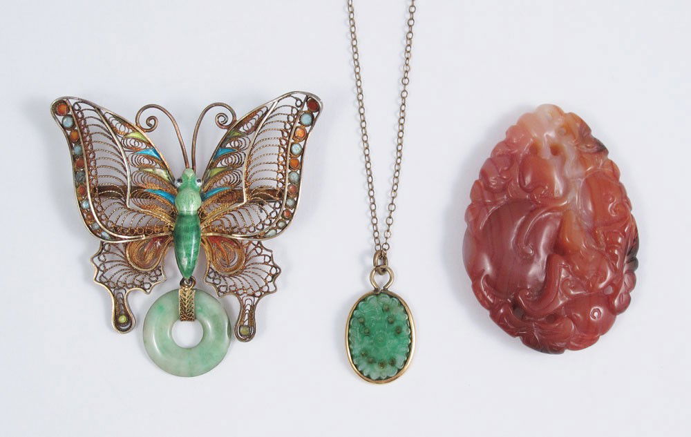 CHINESE CARVED JADE & HARD STONE JEWELRY 3 PC: CARVED JADE & HARD STONE JEWELRY: To include, Carved Chalcedony pendant in brown, 52mm x 37mm; Silver and enamel butterfly brooch with Jadeite jade disc dangle, 2 1/4" x 2 1/4"; sold with pierce carve