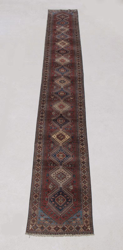 INDO PERSIAN HAND KNOTTED WOOL RUG 2'9" x 18'7" : APPROX. 25-35 YEAR OLD INDO PERSIAN HAND KNOTTED WOOL RUG, 2' 9" x 18' 7 1/2": This extremely long runner has a design that is composed of 16 diamond shaped medallions in a row. The medallions are in 