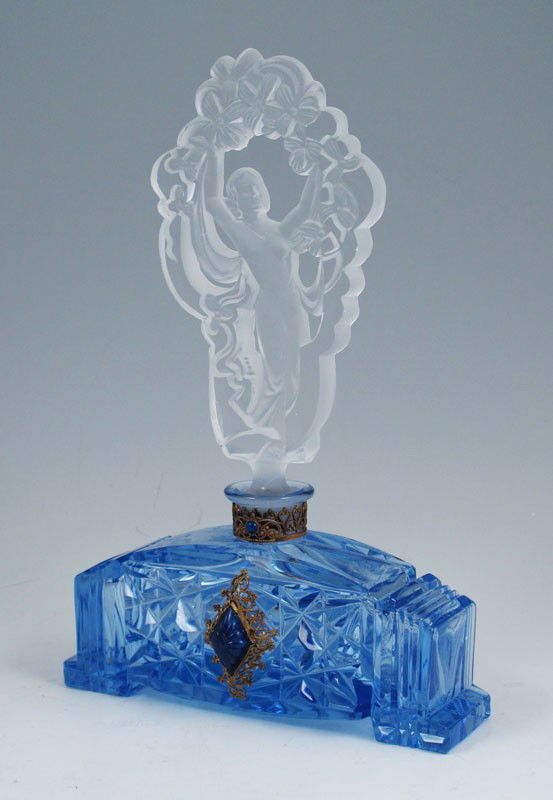 1920'S CZECH GLASS PERFUME W/ NUDE STOPPER: VINTAGE CZECH GLASS PERFUME WITH NUDE STOPPER AND JEWELED METALWORK, CIRCA 1920'S: Frosted glass nude under garland of flowers, dauber intact. The cut glass blue bottle is signed "Made in Czechoslovak